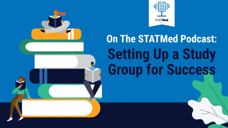 Students sitting on a large pile of books in a study group